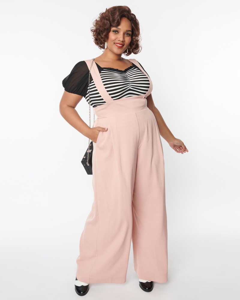 Front of a model wearing a size 2X Unique Vintage Blush Rochelle Suspender Pants in Pink by Unique Vintage. | dia_product_style_image_id:287169